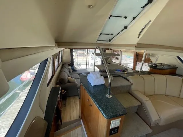 Slide: The Image of Interior of 2000 Carver 530 Voyager Pilothouse with seating and helm station. - 18