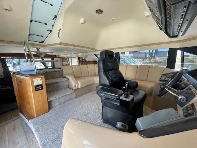 Slide: The Image of Interior of 2000 Carver 530 Voyager Pilothouse with captain's chair and spacious seating area. - 19