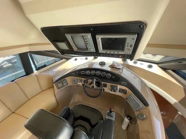 Slide: The Image of Pilothouse interior of 2000 Carver 530 Voyager, featuring navigation equipment and seating. - 20