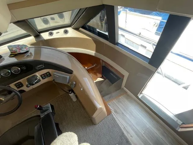 Slide: The Image of Interior view of 2000 Carver 530 Voyager Pilothouse helm with controls and seating. - 22