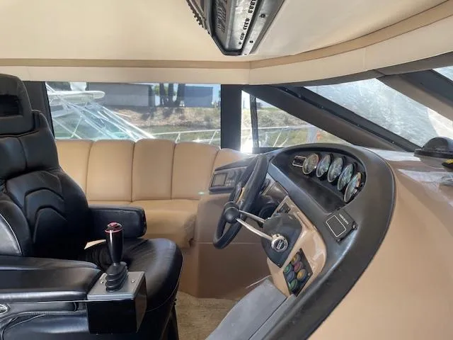 Slide: The Image of Pilothouse interior of 2000 Carver 530 Voyager, featuring leather seating and control panel. - 24