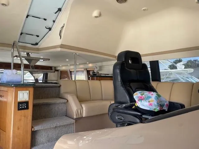 Slide: The Image of Interior of 2000 Carver 530 Voyager Pilothouse with leather seating and helm chair. - 25