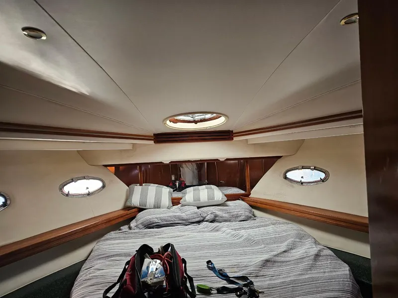 Slide: The Image of Interior cabin of 2000 Carver 530 Voyager Pilothouse with bed and portholes. - 30