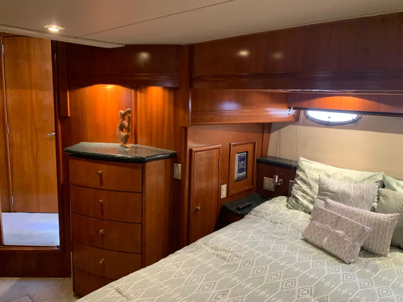 Slide: The Image of Luxurious interior of 2000 Carver 530 Voyager Pilothouse with elegant wood finish. - 33