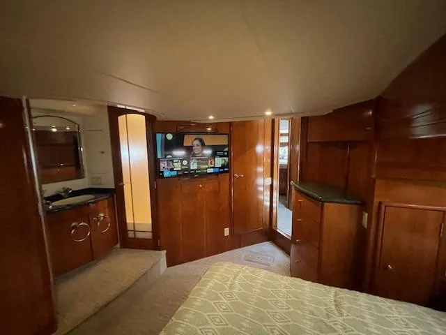 Slide: The Image of Luxurious interior of 2000 Carver 530 Voyager Pilothouse with wood paneling and modern amenities. - 39