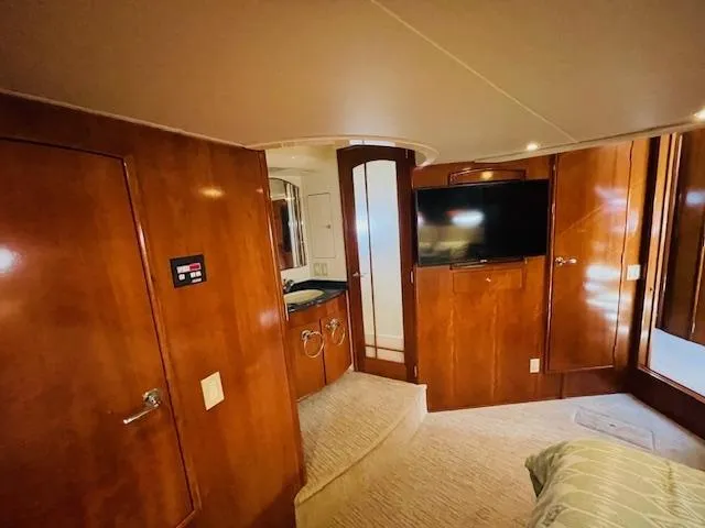 Slide: The Image of Luxurious interior of 2000 Carver 530 Voyager Pilothouse with wood paneling and modern amenities. - 40