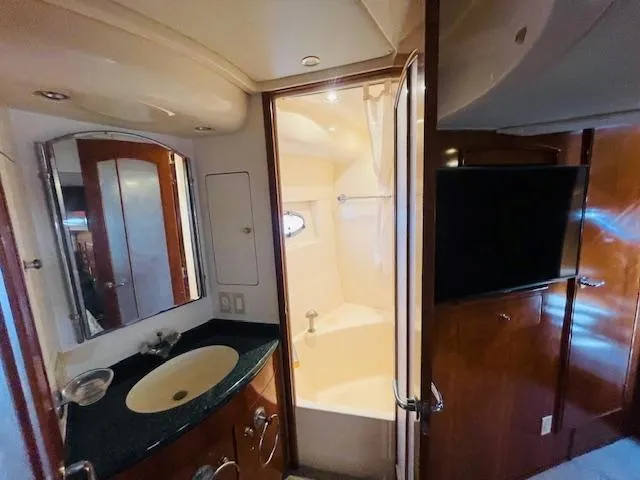 Slide: The Image of Luxurious bathroom in 2000 Carver 530 Voyager Pilothouse yacht with modern amenities. - 42
