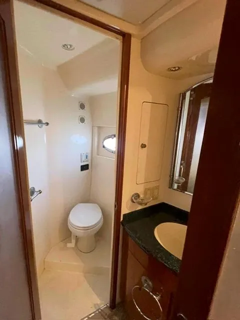 Slide: The Image of Bathroom interior of 2000 Carver 530 Voyager Pilothouse yacht, featuring toilet and sink. - 44