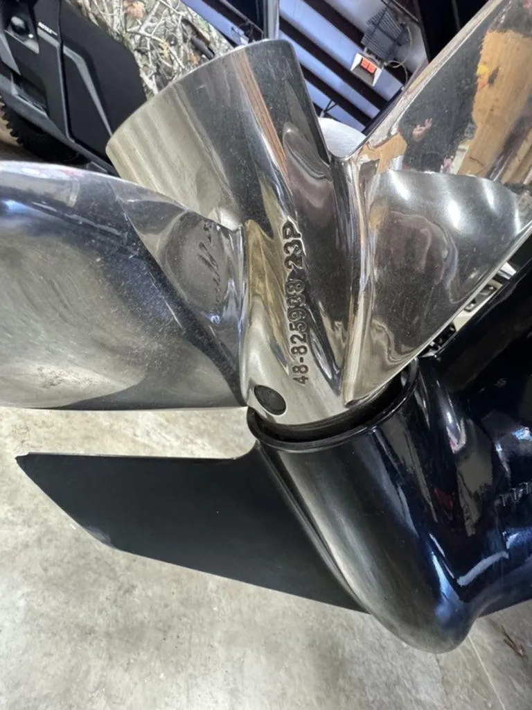 Slide: The Image of Close-up of a 2016 Triton 18 TrX boat propeller with engraved serial numbers. - 21