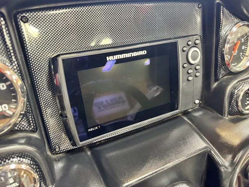 Slide: The Image of Dashboard of a 2016 Triton 18 TrX with Humminbird Helix 7 fish finder. - 32