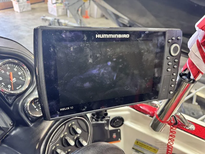 Slide: The Image of Helix 10 fish finder on 2016 Triton 18 TrX boat dashboard. - 33