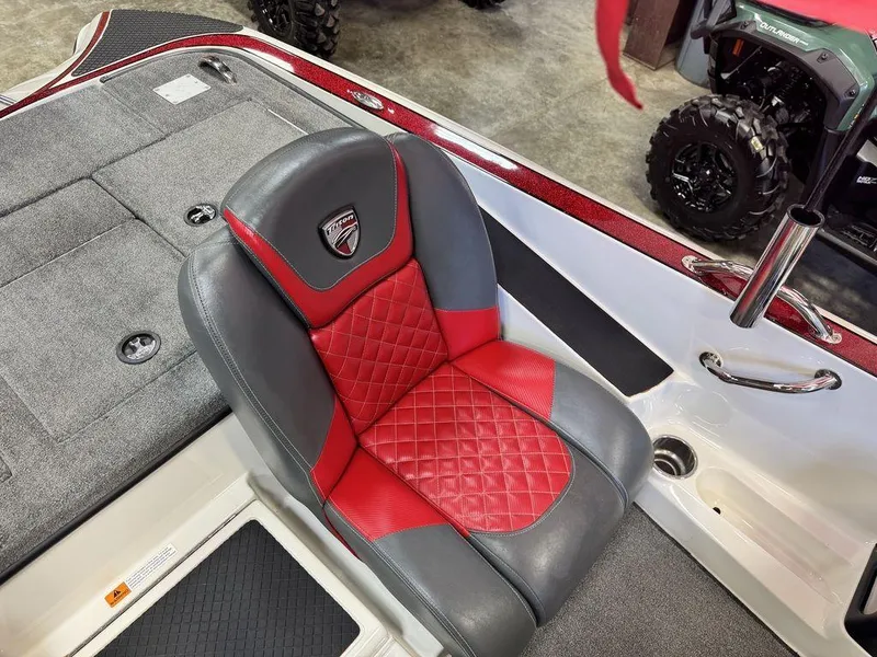 Slide: The Image of 2016 Triton 18 TrX boat seat with red and gray upholstery, diamond pattern design. - 34