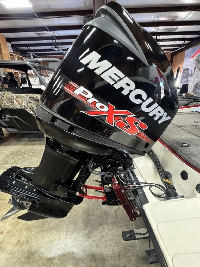 Slide: The Image of 2016 Triton 18 TrX boat with Mercury Pro XS outboard motor in a showroom. - 8