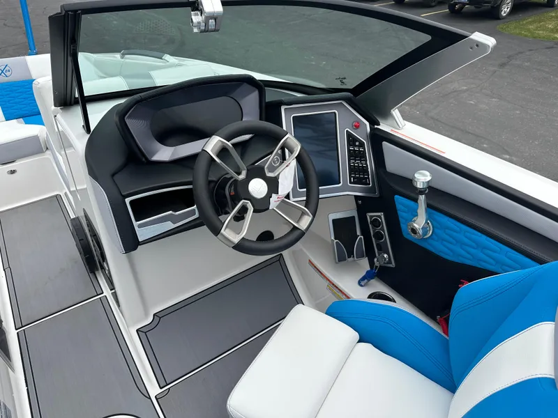 Slide: The Image of 2023 MasterCraft X24 boat interior with modern steering and control panel. - 12