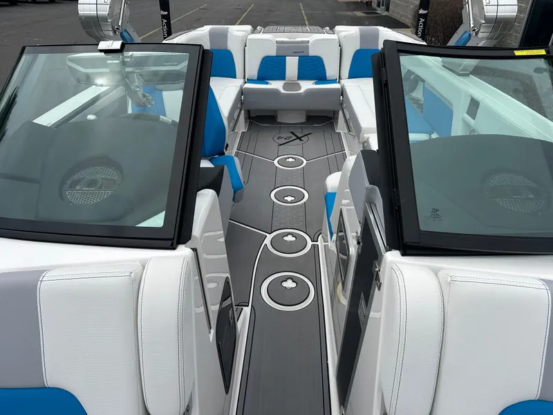 Slide: The Image of 2023 MasterCraft X24 boat interior with blue and white seating, modern design. - 21