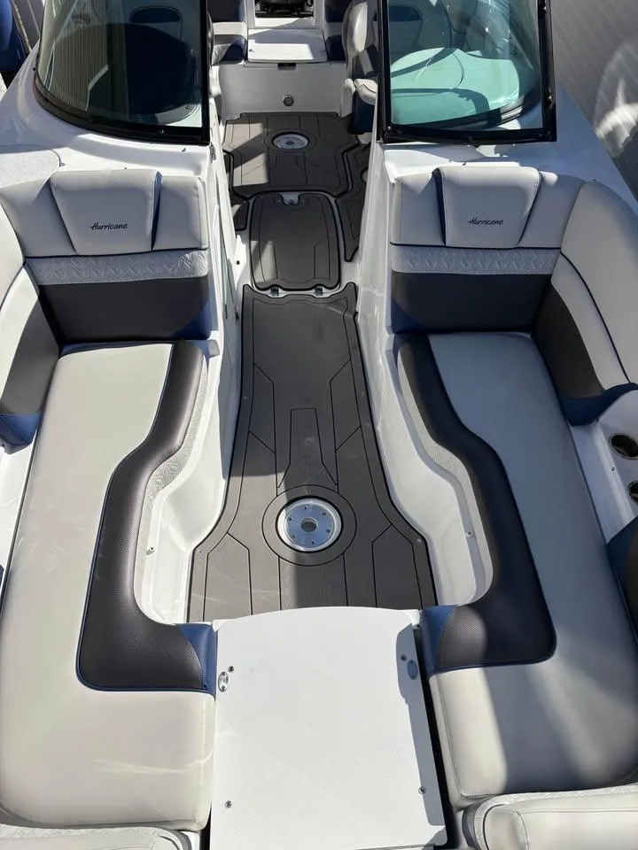 Slide: The Image of 2022 Hurricane SunDeck 2486 OB boat interior with spacious seating and modern design. - 3