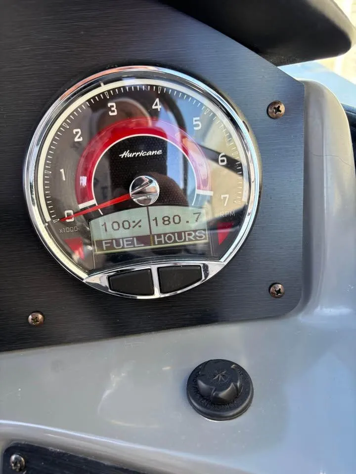 Slide: The Image of Gauge display on 2022 Hurricane SunDeck 2486 OB showing fuel and hours. - 7