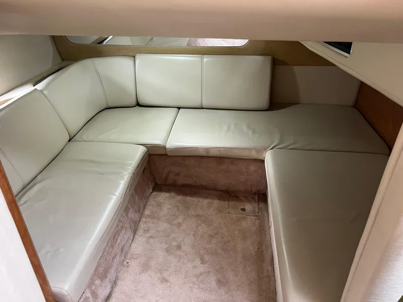 Slide: The Image of 2003 Regal Commodore 3260 interior with beige leather seating and carpeted flooring. - 13