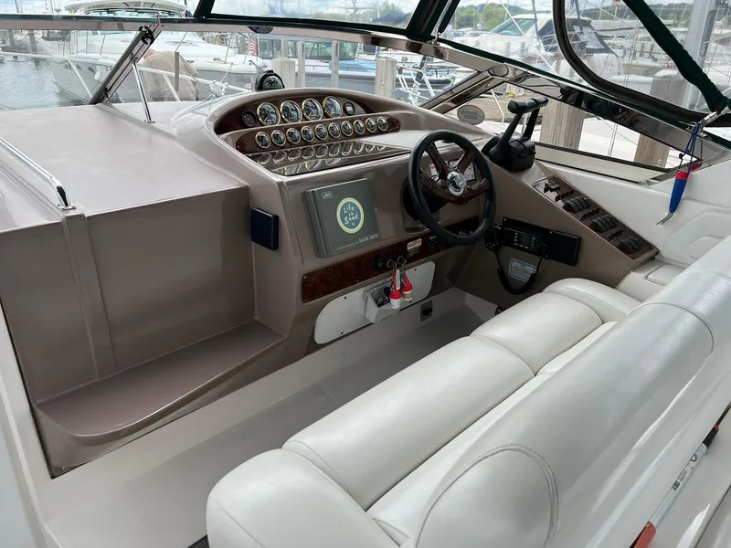 Slide: The Image of Cockpit of 2003 Regal Commodore 3260 boat with steering wheel and control panel. - 5