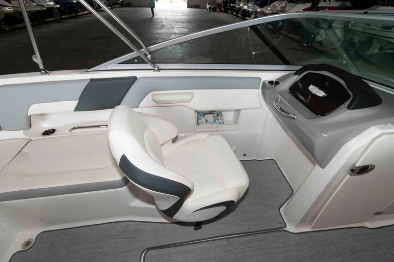 Slide: The Image of Interior of 2022 Chaparral 23 SSi boat with white seating and modern dashboard. - 10