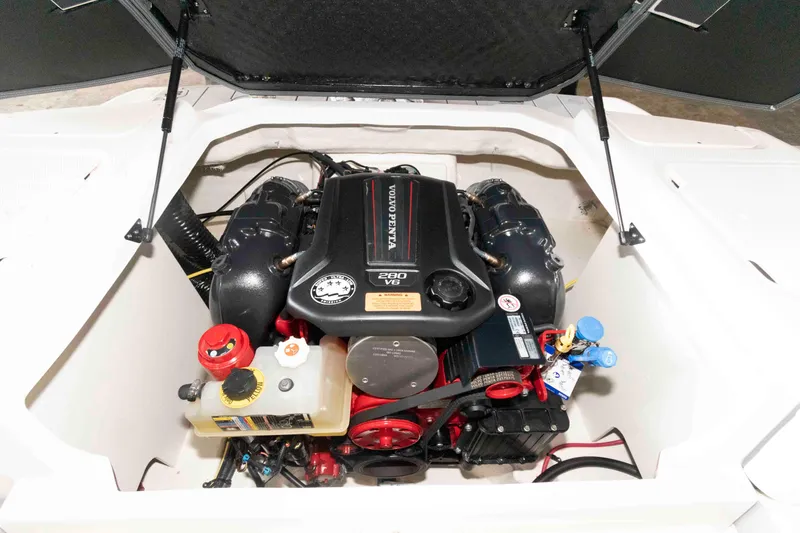 Slide: The Image of 2022 Chaparral 23 SSi engine compartment showcasing a powerful V8 engine. - 12
