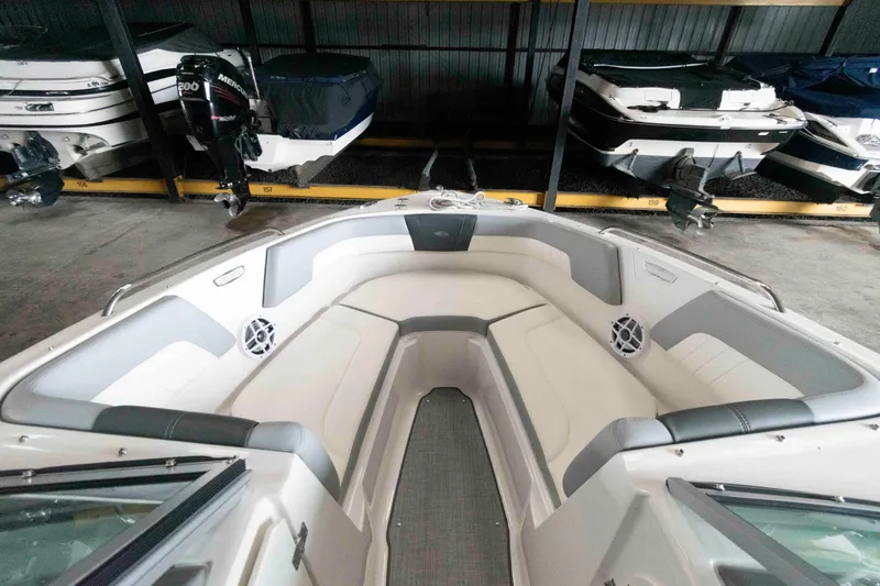 Slide: The Image of 2022 Chaparral 23 SSi boat interior with spacious seating in storage facility. - 6