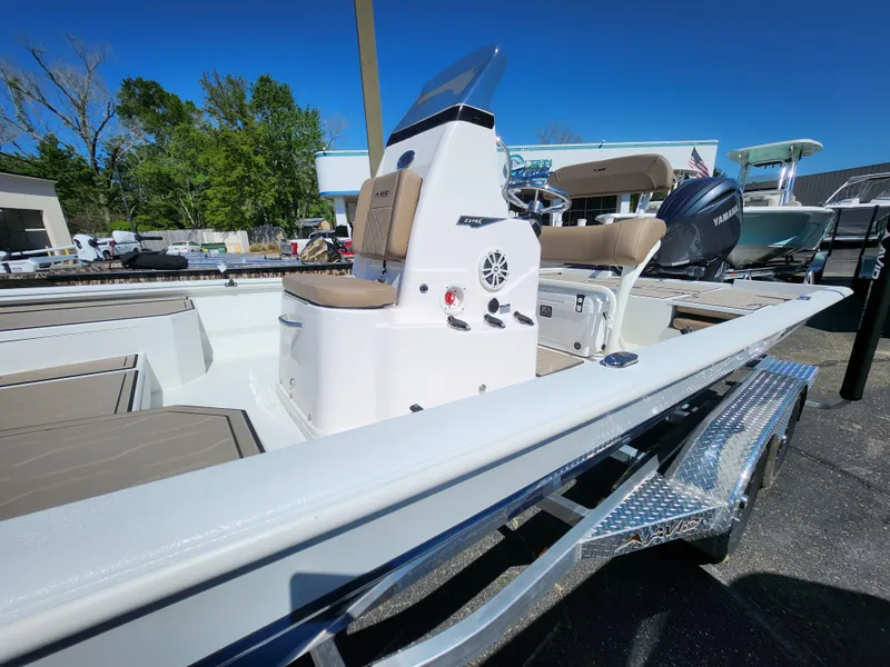 Slide: The Image of 2025 Avid 23FSX boat on trailer, featuring sleek design and modern amenities. - 13