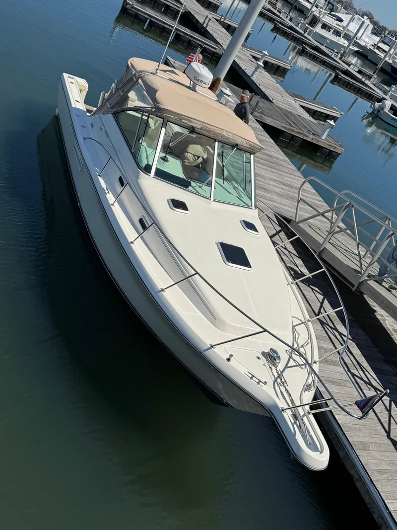 Slide: The Image of 2001 Pursuit 3000 Express boat docked at a marina, viewed from above. - 7