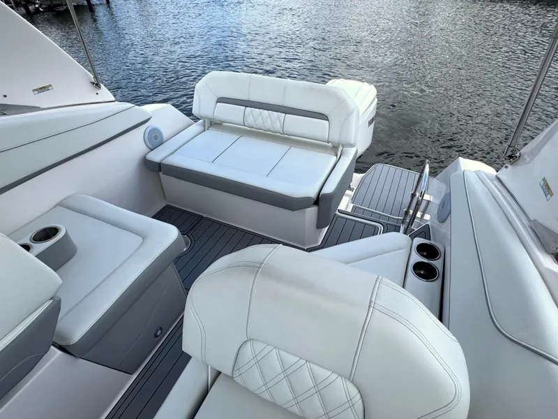 Slide: The Image of Luxurious seating on 2024 Regal 26 XO boat with water view. - 10