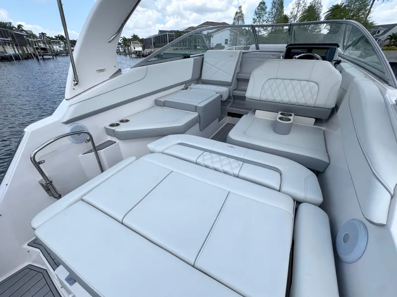 Slide: The Image of 2024 Regal 26 XO boat interior with luxurious white seating and modern design. - 15