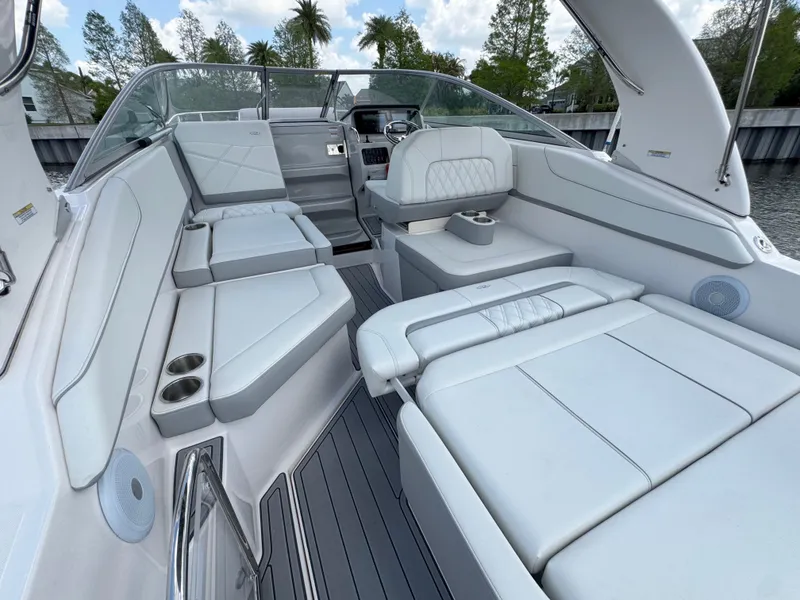 Slide: The Image of 2024 Regal 26 XO boat interior with luxurious white seating and modern design. - 16