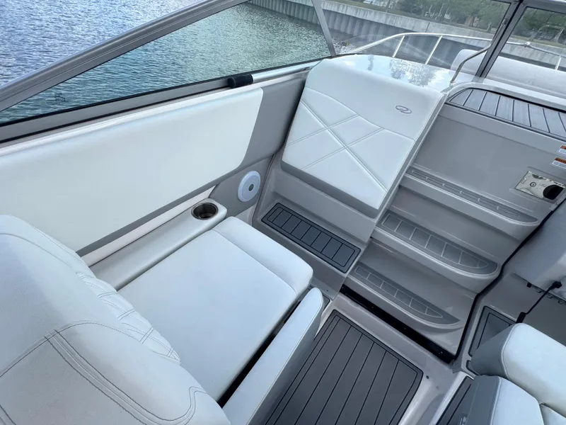 Slide: The Image of 2024 Regal 26 XO boat interior with sleek seating and modern design. - 17