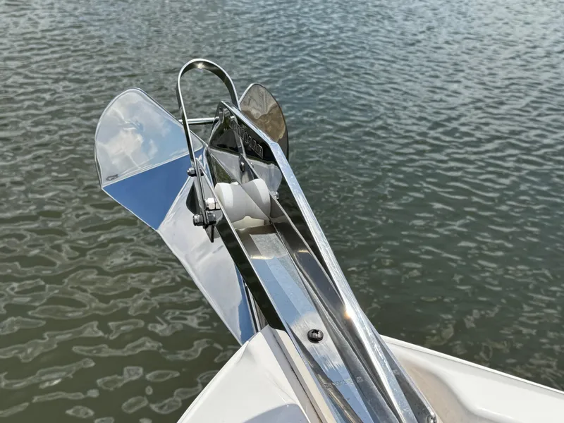 Slide: The Image of 2024 Regal 26 XO boat anchor detail over water. - 37