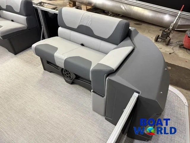 Slide: The Image of 2025 Tahoe Geofish 2385 boat interior with gray seating and "Boat World" logo. - 10