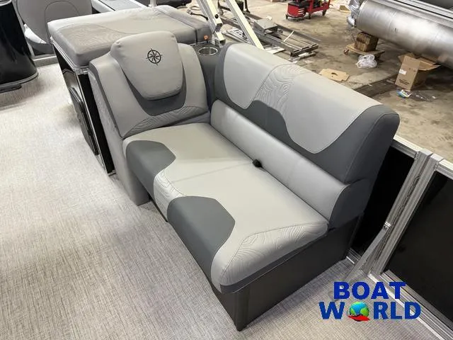 Slide: The Image of 2025 Tahoe Geofish 2385 boat interior with gray seating, showcased at Boat World. - 11