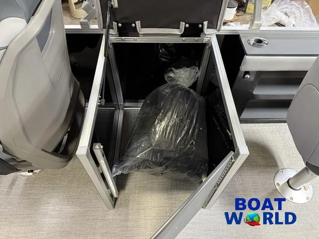 Slide: The Image of Open storage compartment in 2025 Tahoe Geofish 2385 boat, featuring Boat World branding. - 23