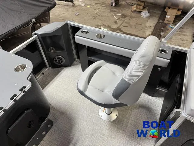 Slide: The Image of 2025 Tahoe Geofish 2385 boat interior with swivel chair and storage compartments. - 24