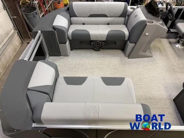 Slide: The Image of 2025 Tahoe Geofish 2385 boat interior with gray seating and steering console. - 3