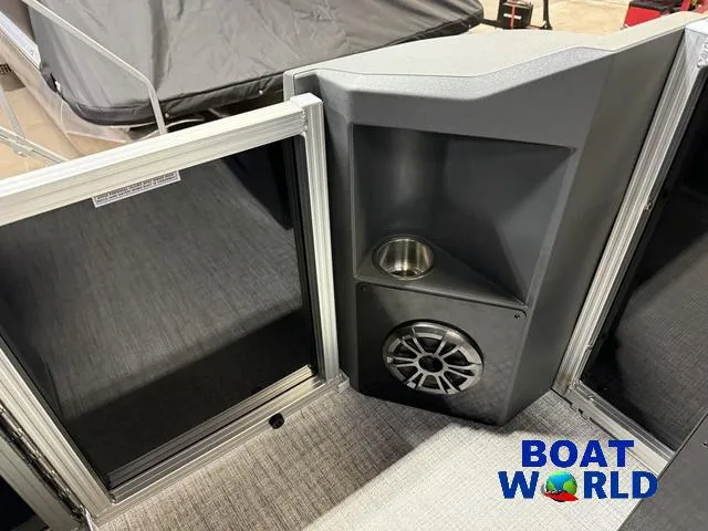 Slide: The Image of 2025 Tahoe Geofish 2385 boat interior with speaker and cup holder, showcased at Boat World. - 30