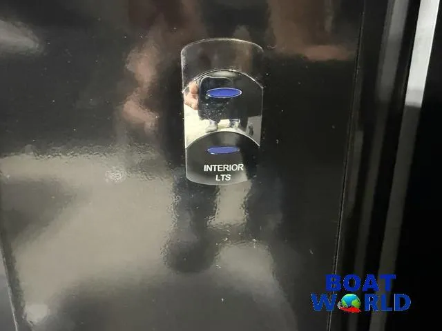 Slide: The Image of Interior light switch on a 2025 Tahoe Geofish 2385 boat panel. - 32