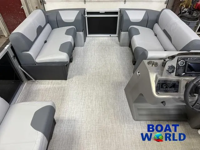 Slide: The Image of 2025 Tahoe Geofish 2385 boat interior with gray seating and modern dashboard. - 40