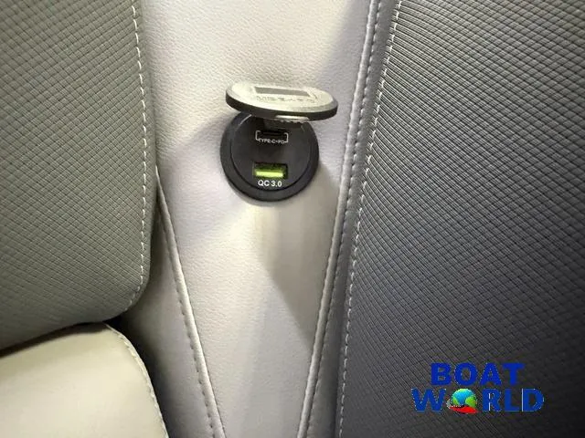 Slide: The Image of USB charging port on 2025 Tahoe Geofish 2385 boat interior, featuring QC 3.0 technology. - 41