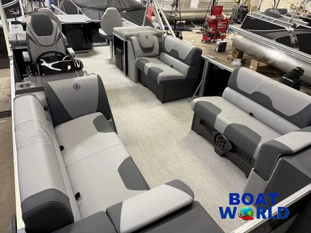 Slide: The Image of 2025 Tahoe Geofish 2385 boat interior with gray seating and steering console. - 43