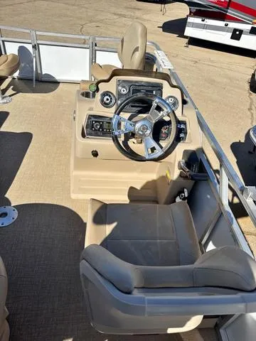 Slide: The Image of 2022 Avalon VTX1880QF boat interior with steering wheel and control panel. - 10