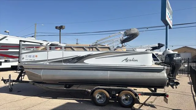 Slide: The Image of 2022 Avalon VTX1880QF pontoon boat on trailer, parked outdoors. - 15