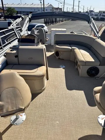 Slide: The Image of 2022 Avalon VTX1880QF pontoon boat interior with beige seating and spacious deck. - 16