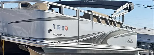 Slide: The Image of 2022 Avalon VTX1880QF pontoon boat with sleek design and modern features. - 3