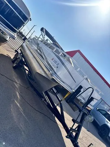 Slide: The Image of 2022 Avalon VTX1880QF boat on trailer under bright sunlight. - 4