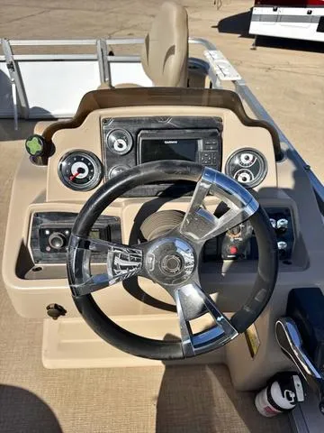 Slide: The Image of Steering console of a 2022 Avalon VTX1880QF boat with modern controls and instruments. - 5