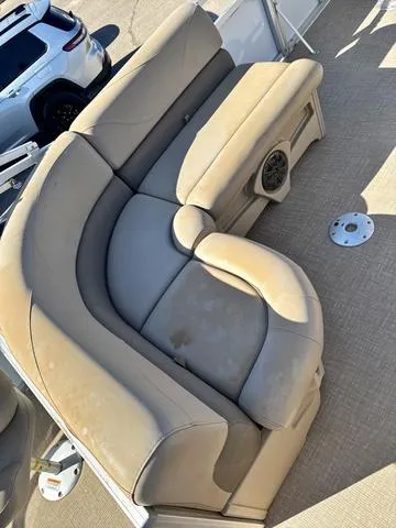 Slide: The Image of Beige seating on 2022 Avalon VTX1880QF boat, with speaker and carpeted floor. - 7